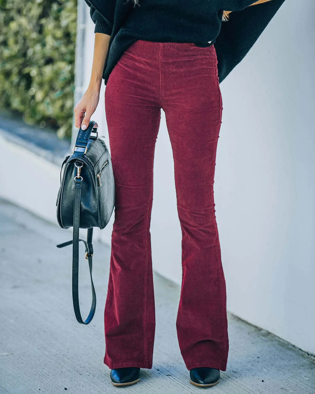 Women's high waisted corduroy flare pants in burgundy