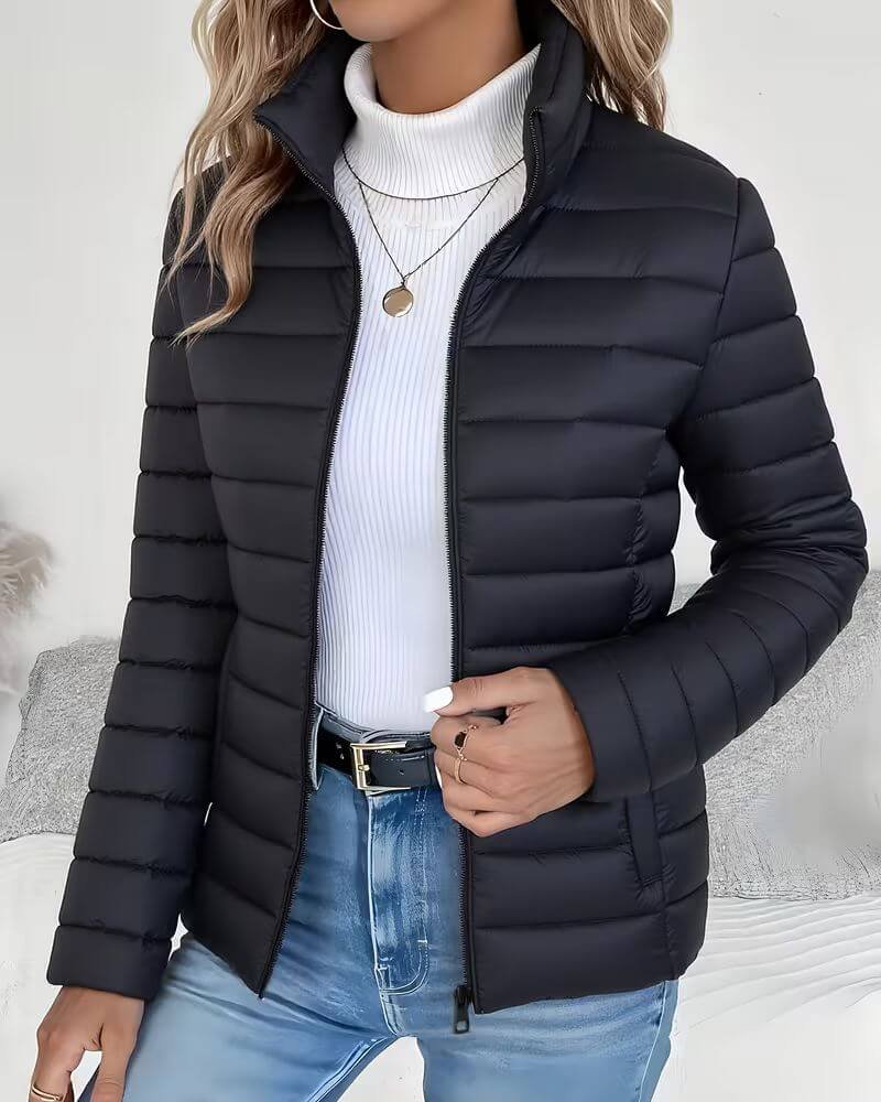 Black channel quilted fall jacket with high zip collar for women