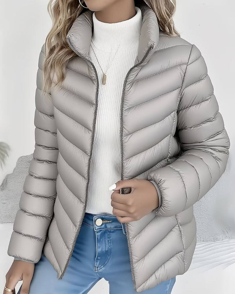 Grey channel quilted fall jacket with high zip collar for women