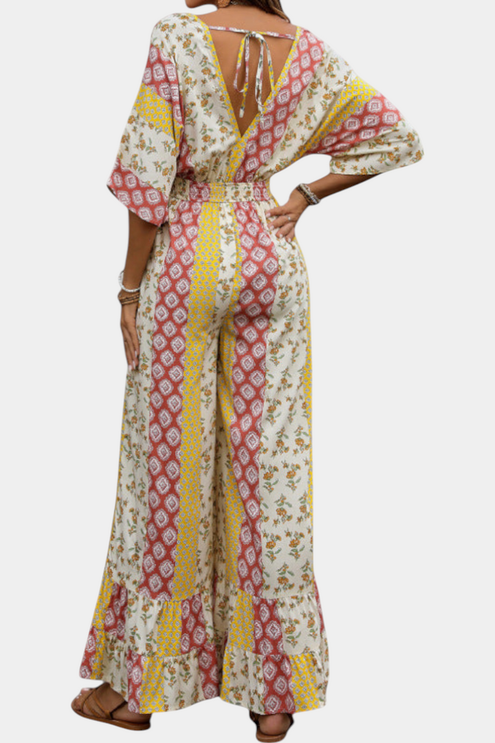 Women's bohemian print V-neck jumpsuit with flowing sleeves detail