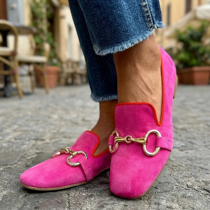 Women's fuchsia suede metal bar loafer, worn