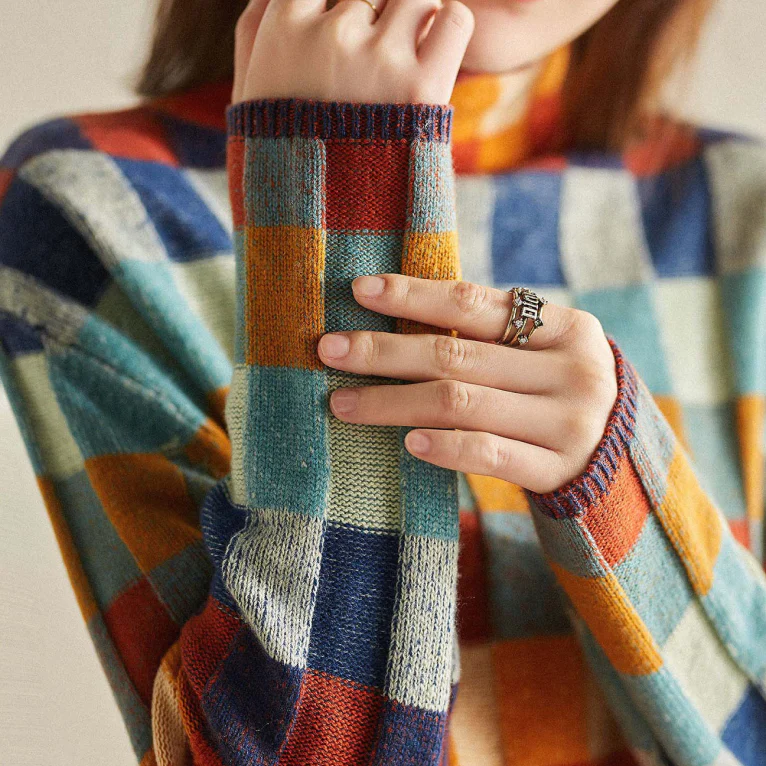 Plaid patchwork knit sweater sleeve detail