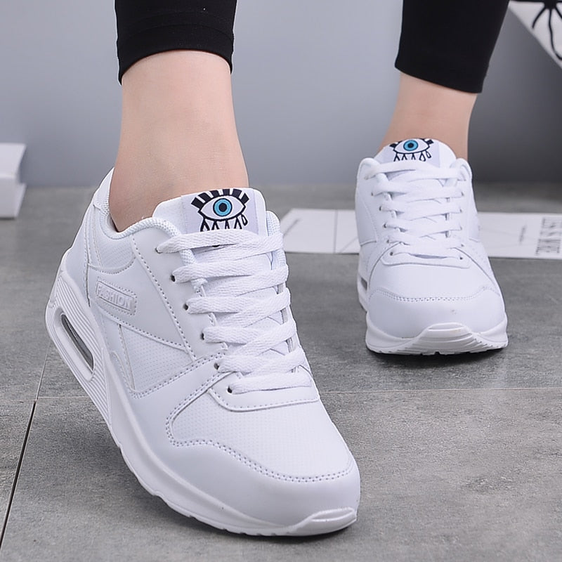 White lace up low top eye graphic sneakers