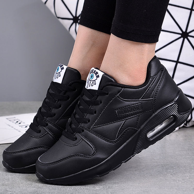 Black lace up low top eye graphic sneakers