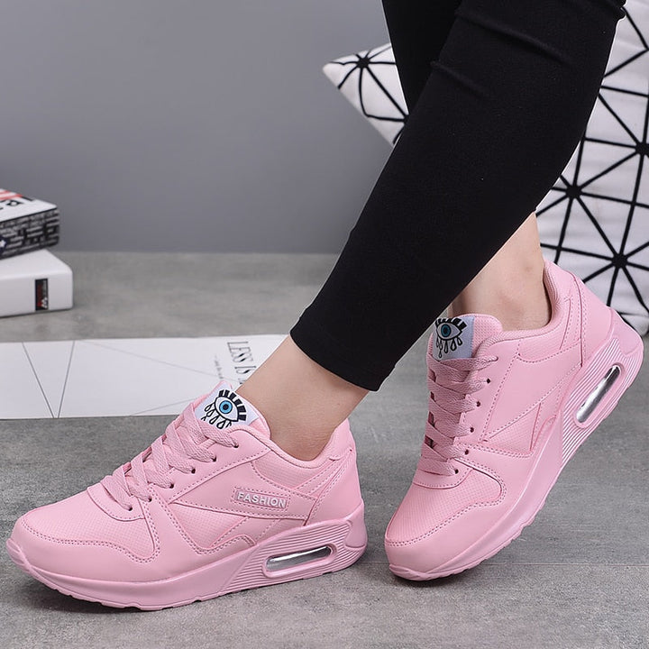Pink lace up low top eye graphic sneakers