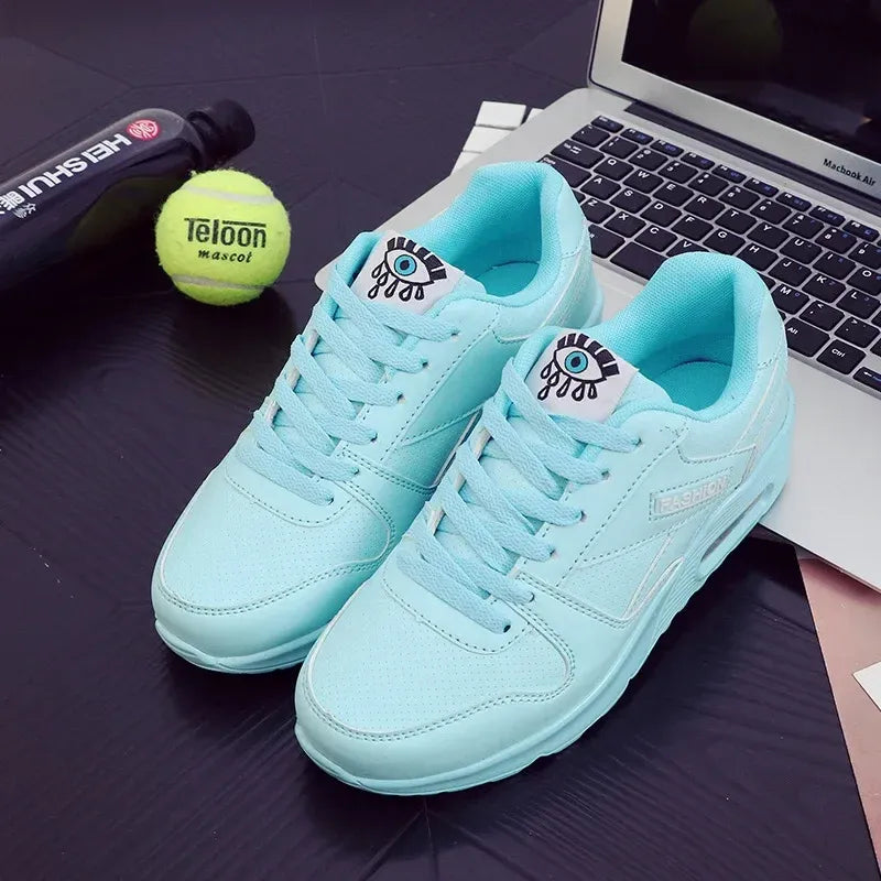Blue lace up low top eye graphic sneakers