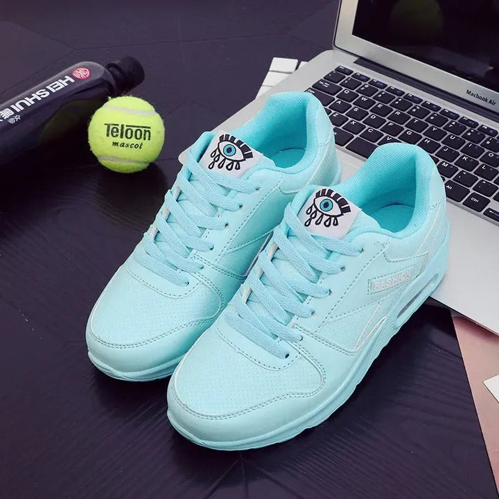 Blue lace up low top eye graphic sneakers